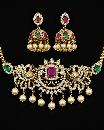 Ornate necklace and earrings set with gemstones on a black background