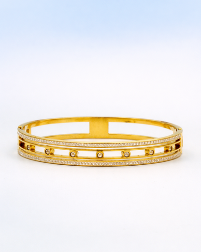 Gold bracelet with small stones on a white background