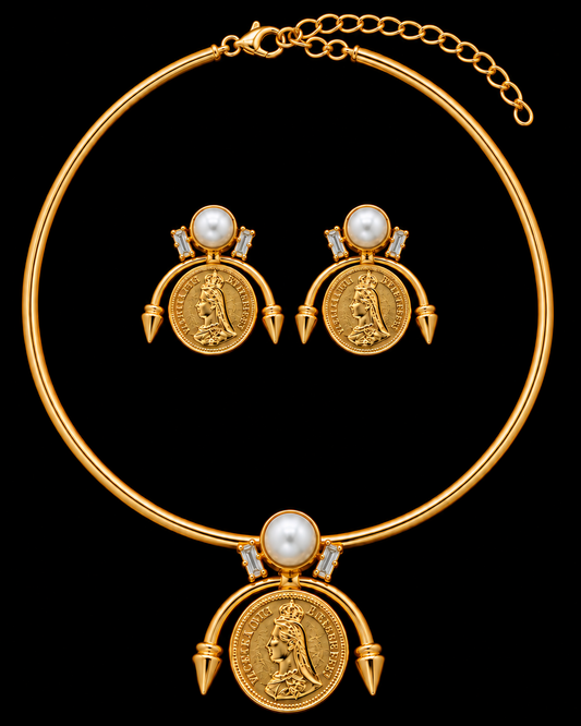 Gold necklace and matching drop earrings featuring coin-style medallion pendants, pearl accents, and small clear stones, displayed on a black background.