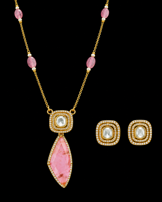 Pink gemstone moissanite necklace with matching stud earrings on a black background