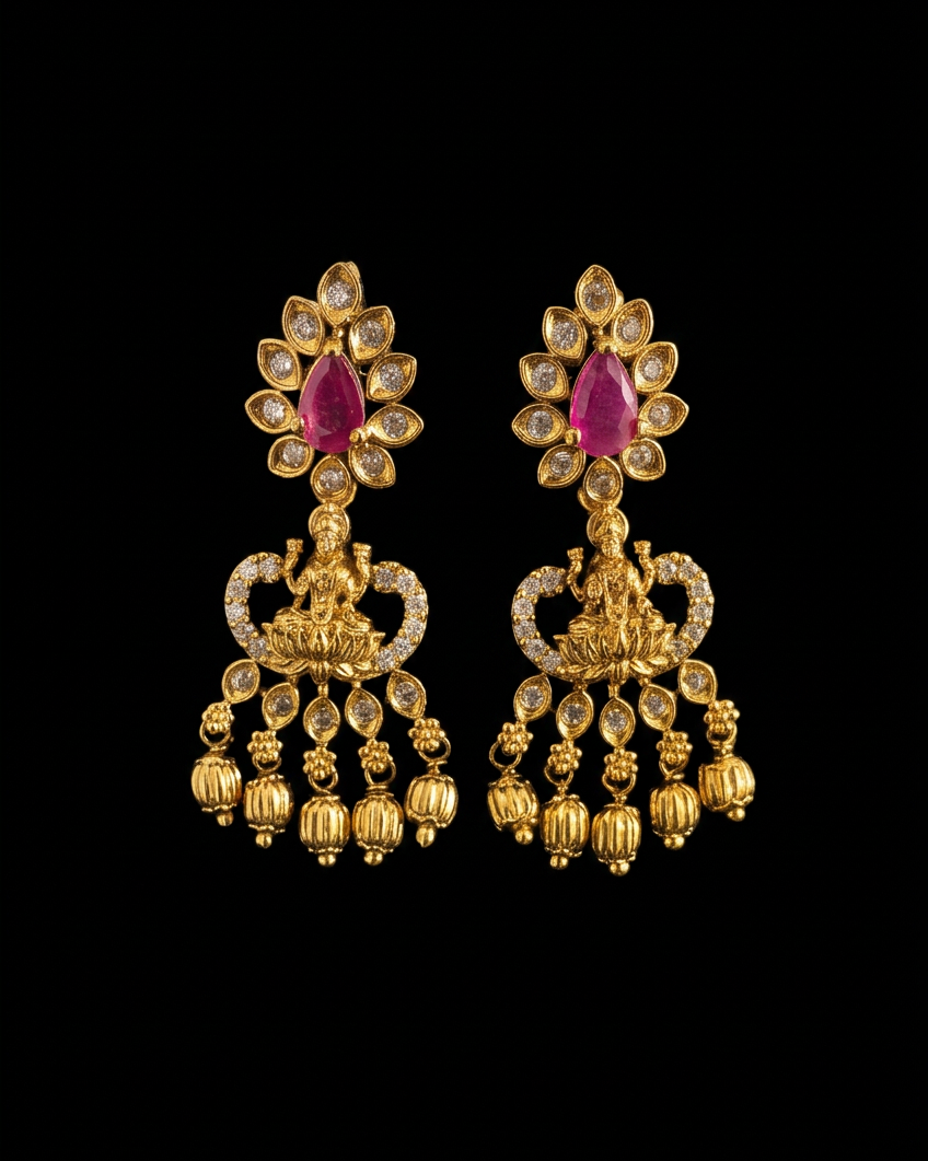 Rani Pink gold chandelier earrings set with magenta kemp stones and gold bead drops, on a black background