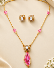 Pink gemstone moissanite pendant necklace with matching earrings on black